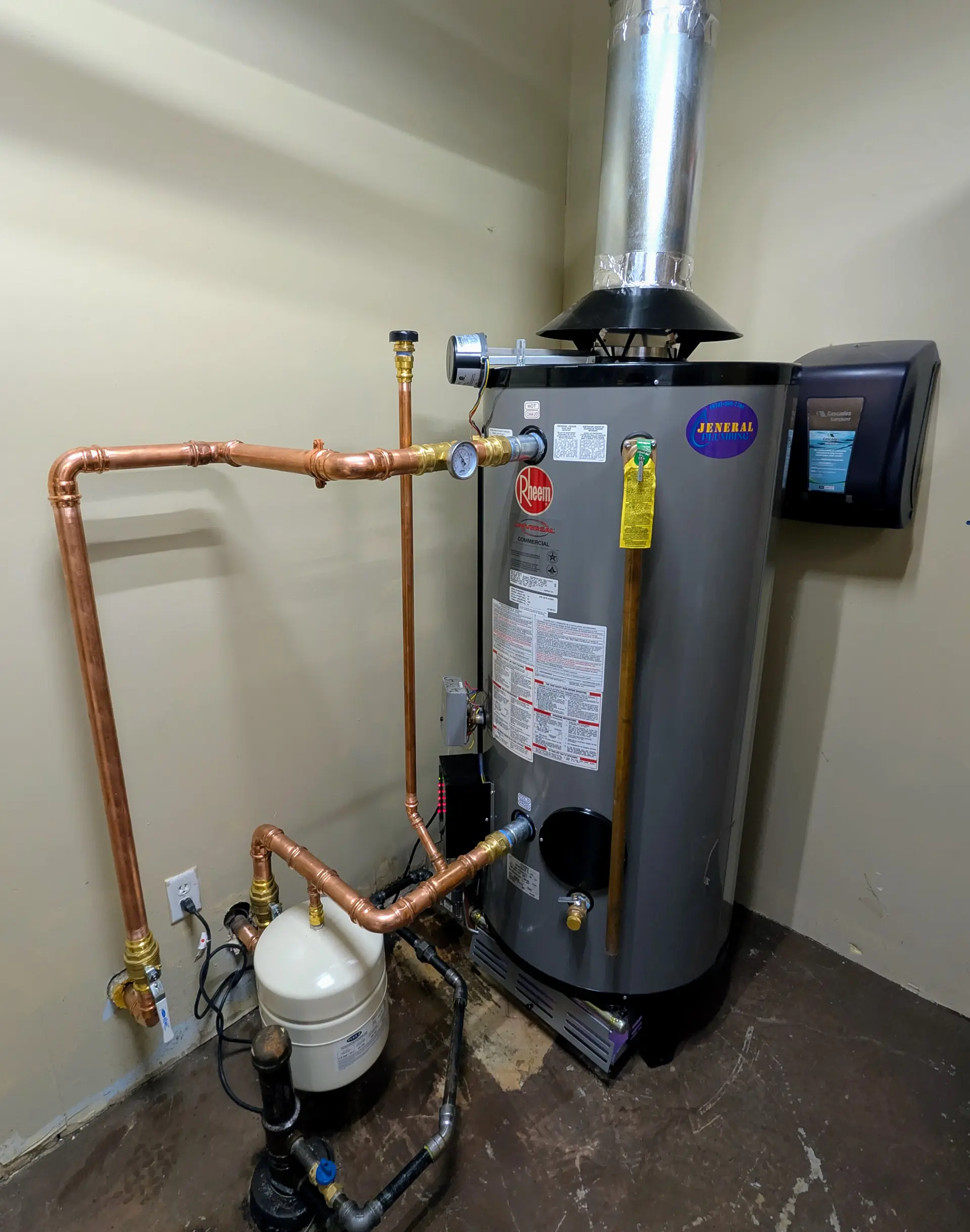 Rheem chimney-vented gas water heater with draft hood, expansion tank, and copper piping installed by Jeneral Plumbing